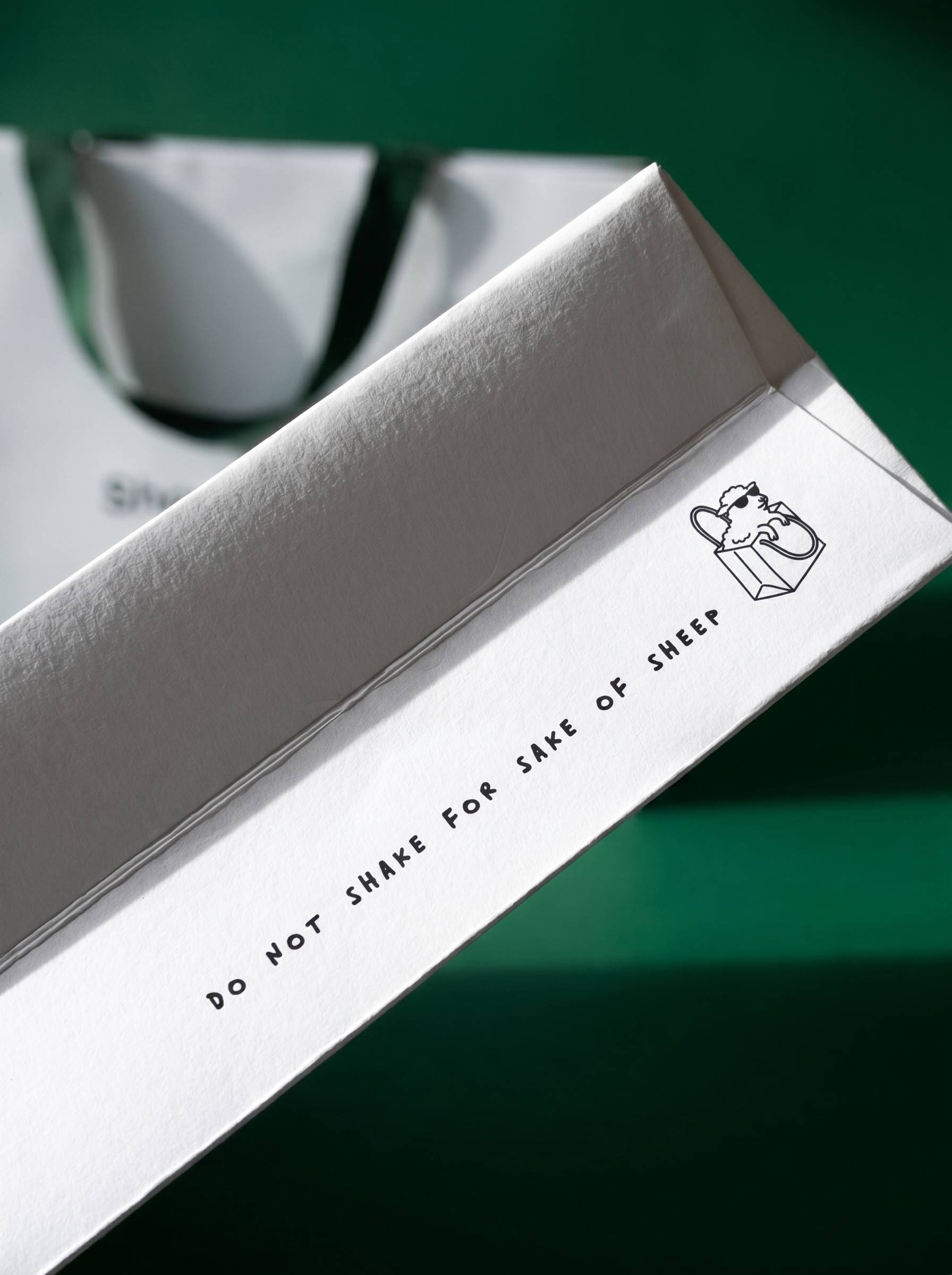 Box side detail — Do not shake for sake of sheep