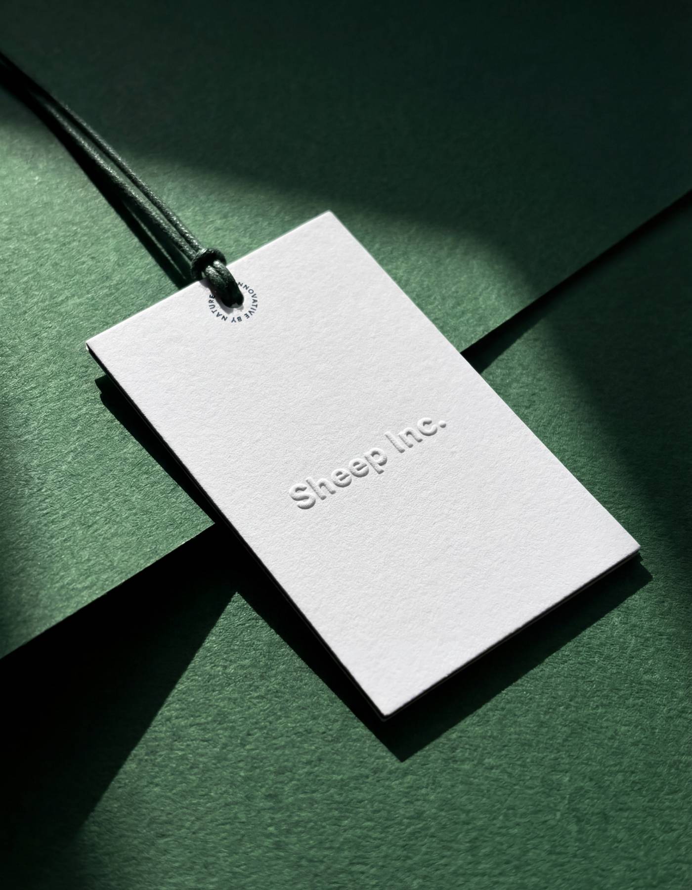 Embossed swing ticket on uncoated stock